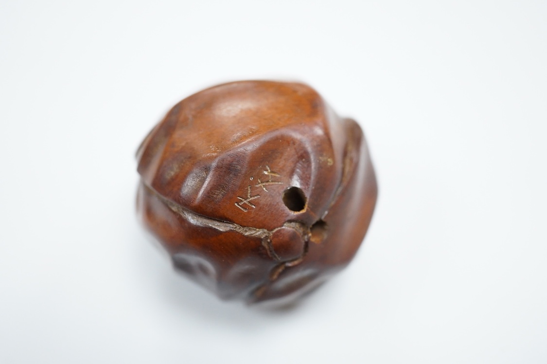 Three carved hardwood netsuke, signed